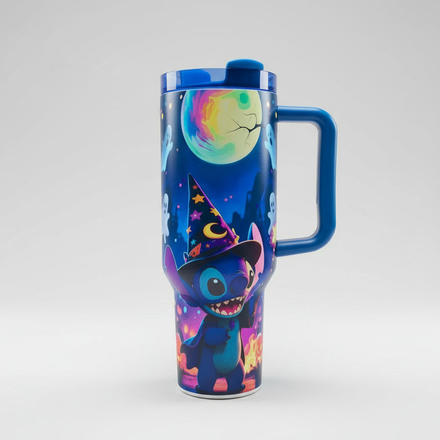 Colorful tumbler with cartoon character design on a striped surface with green foliage in the background